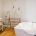 La Palmeraie in La Baule-Escoublac bathroom with freestanding tub, vanity, towels and robes