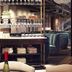 The Steam Hotel Västerås bar and lounge with hanging wine glasses and velvet seating