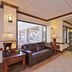 Quality Inn & Suites Williamsport lobby with leather sofa, lamps, tile floor and entrance