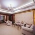 Taizhou Chunlan Hotel, Taizhou: spacious suite with chandelier, seating area, and TV.