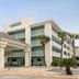 Surf & Sand Hotel in Pensacola Beach exterior with palm trees and covered entrance