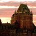 Comfort Inn Ancienne-Lorette - Quebec Airport exterior at sunset with dramatic sky and historic architecture