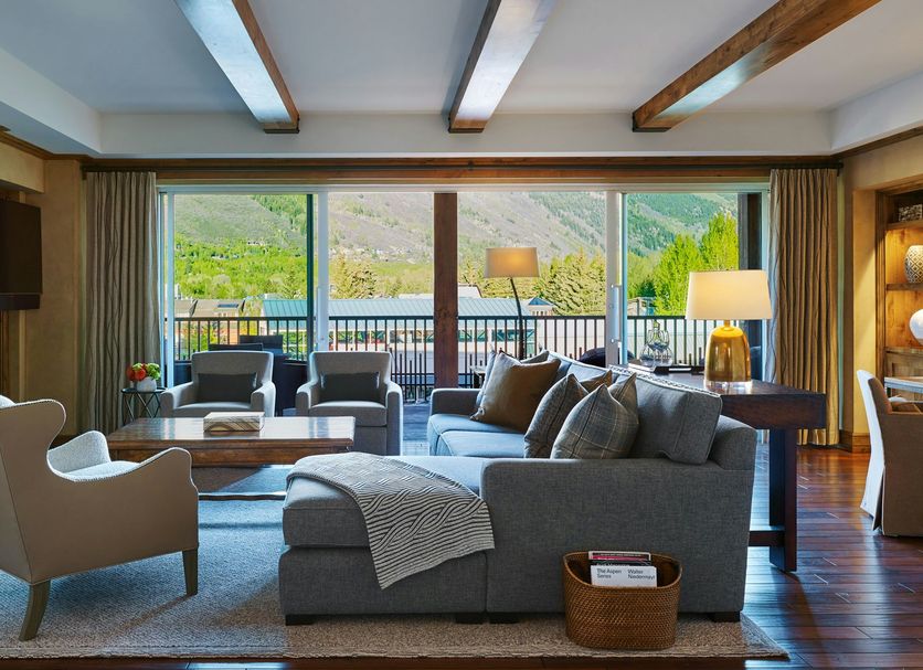 Residences at The Little Nell Aspen living room with mountain views and fireplace