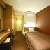 Business Hotel Cuore in Tsuruga room with single bed, desk and wood-accented interior