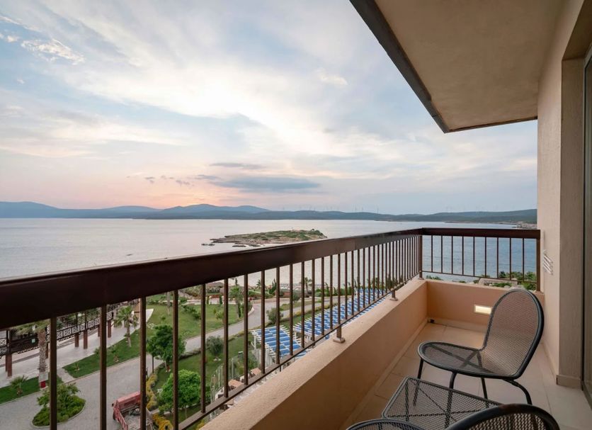 Royal Teos Thermal Resort Clinic & Spa in Seferihisar balcony with sea view and lounge chairs