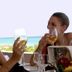 Guests toast with drinks at Th Costa Rei - Free Beach Resort overlooking the beach in Costa Rei.