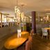 Premier Inn Ashford - Eureka Leisure Park dining area with curved booth seating and pendant lights