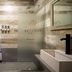 Che Juan Hostel Ba in Buenos Aires bathroom with walk-in shower, frosted glass partition, and vessel sink
