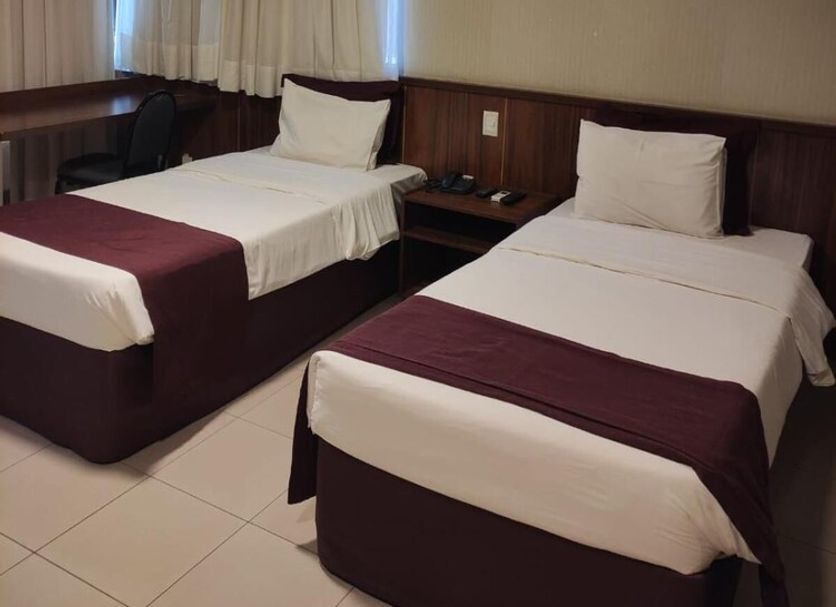 Esplanada Brasilia Hotel in Brasilia twin guest room with two single beds and curtained windows