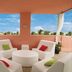 Hilton Grand Vacations at McAlpin-Ocean Plaza terrace with white chairs and ocean-view sky in Miami Beach