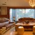Monarch Plaza Hotel Taoyuan City opulent lobby with leather sofas, ornate coffee table and chandelier