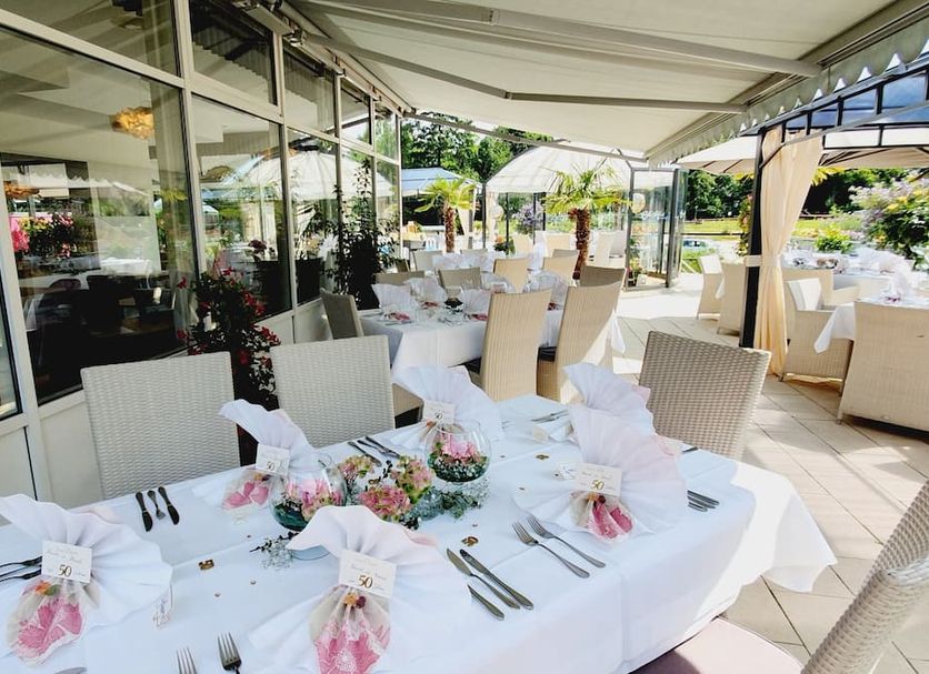 Eden Hotel in Bad Krozingen outdoor terrace with set dining tables and garden views