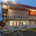 Red Roof Inn Phoenix-Midtown exterior at dusk with two-story building, balcony, and parking lot