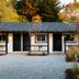 Brentwood Hotel in Saratoga Springs courtyard with gravel path and autumn trees