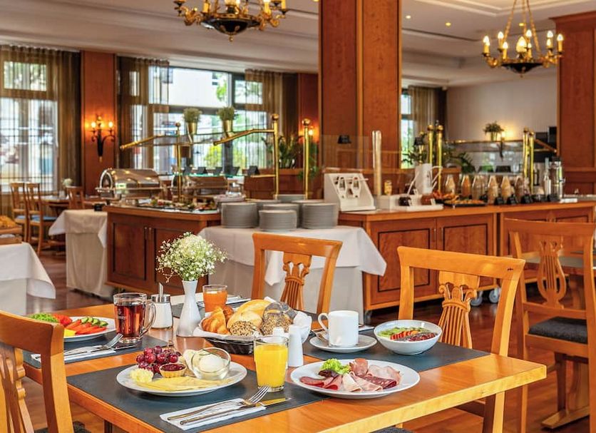 Victor's Residenz-Hotel Berlin Mitte breakfast buffet with dining tables in Berlin