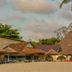 Best Western Jangwani Sea Breeze Hotel in Dar Es Salaam with thatched-roof poolside lounge and outdoor seating