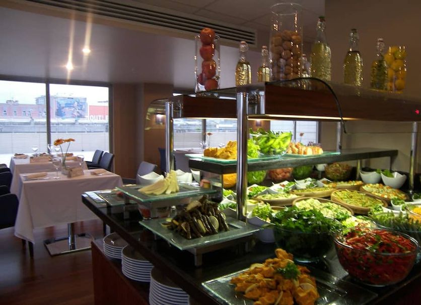 City One Hotel in Kayseri breakfast buffet with fresh fruit, salads, and pastries in a dining room