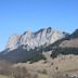 Bon-Séjour in Thollon-les-Mémises with alpine mountain peaks and forested slopes under a clear blue sky