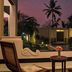 Amritara The Poovath Beachfront Heritage, Fort Kochi courtyard view at dusk with palms and pool