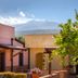 La Terra Dei Sogni Country Hotel in Taormina with courtyard, citrus tree and mountain backdrop