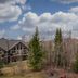 Elkwater Lake Lodge And Resort in Elkwater with chalet-style rooms amid trees and hills
