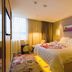 Lavande Hotel Yichang Baota River Wanda room with queen bed, bedside tables and city window