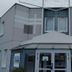 B&B HOTEL Montluçon exterior entrance with glass doors and modern gray facade