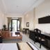 Hon Rom Central Beach Resort room with bed, desk, balcony doors and seating area in Mũi Né