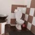 Eden Beach Saint-Louis bathroom with sink, toilet and tiled walls in Saint-Louis