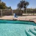 Baymont by Wyndham San Antonio Airport pool with clear water, fence, and pool steps in San Antonio