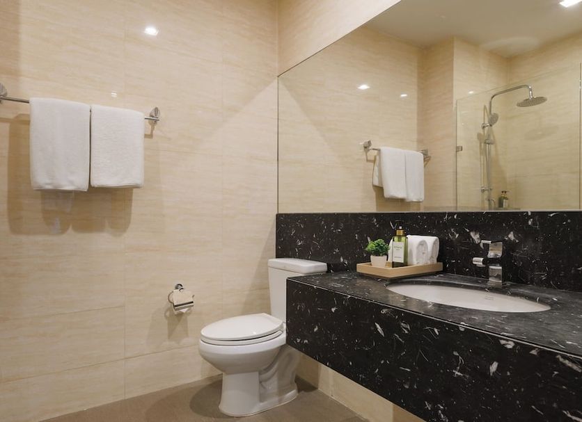 iCheck inn Residence soi 2 Bangkok bathroom with shower, toilet, sink and towel rack