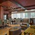 The Leo Kent Hotel, Tucson, a Tribute Portfolio Hotel dining room with upholstered seating and large windows