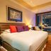 Hotel Eclat Beijing, an SLH Hotel guest room with king bed, desk, and city view in Beijing