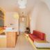 Casa Bassa in Valencia lobby with red bench seating, reception desk, and arched hallway