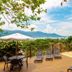 Pousada Perequê in Ilhabela with pool deck, lounge chairs, and mountain and ocean views