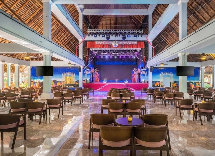 Iberostar Waves Quetzal in Playa del Carmen featuring a large indoor stage and open-air dining hall