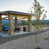 My Place Hotel-Colorado Springs, CO stone pavilion with outdoor seating and mountain views