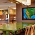 Fairfield Inn & Suites by Marriott Batesville lobby with large green table and wall-mounted TV