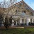 Sure Hotel by Best Western Limoges Sud in Feytiat, exterior of a white building with red roof and tree-lined lawn