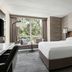 Lincolnshire Marriott Resort guest room with king bed, large window seat and wooded view in Lincolnshire