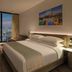 AC Hotels by Marriott Los Downtown Los Angeles guest room with city skyline view and large window in Los Angeles