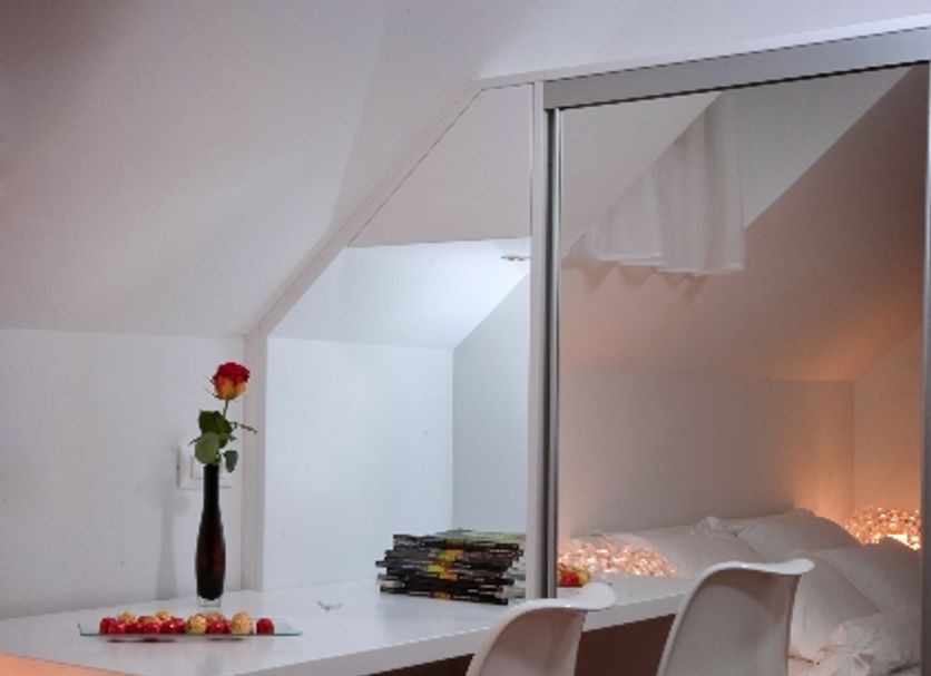Divota Apartment Hotel in Split with a cozy desk, white swivel chairs and mirrored bedroom wall