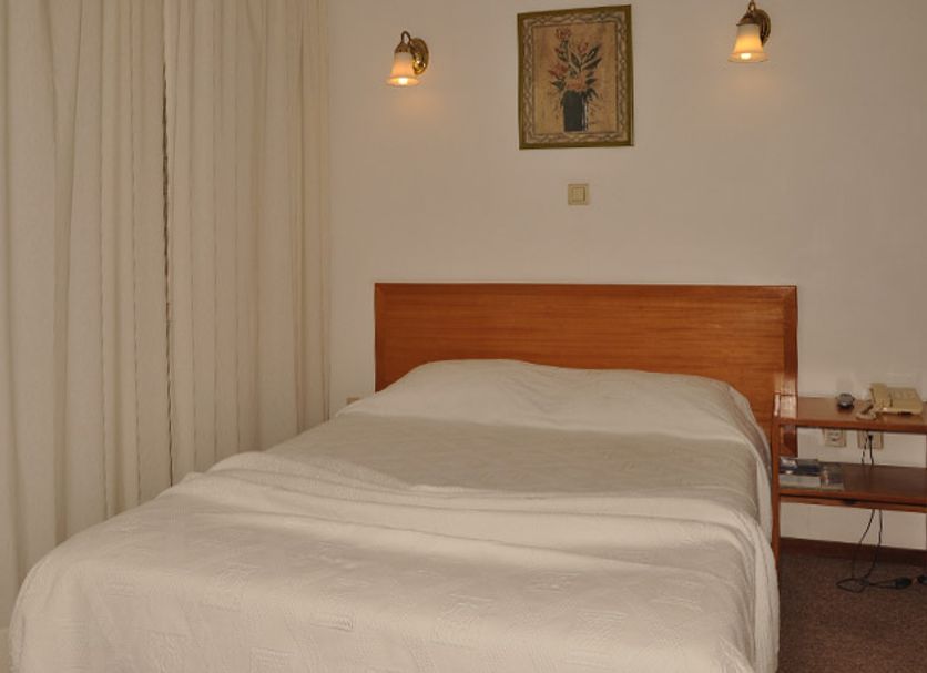 Residencial D. João III in Ponta Delgada guest room with twin bed and bedside lamps