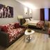 City Park Hotel in Chisinau: stylish guest room with sofa, armchair, bed, and window with curtains