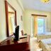 Venardos Hotel in Agia Pelagia room with two twin beds and open balcony doors