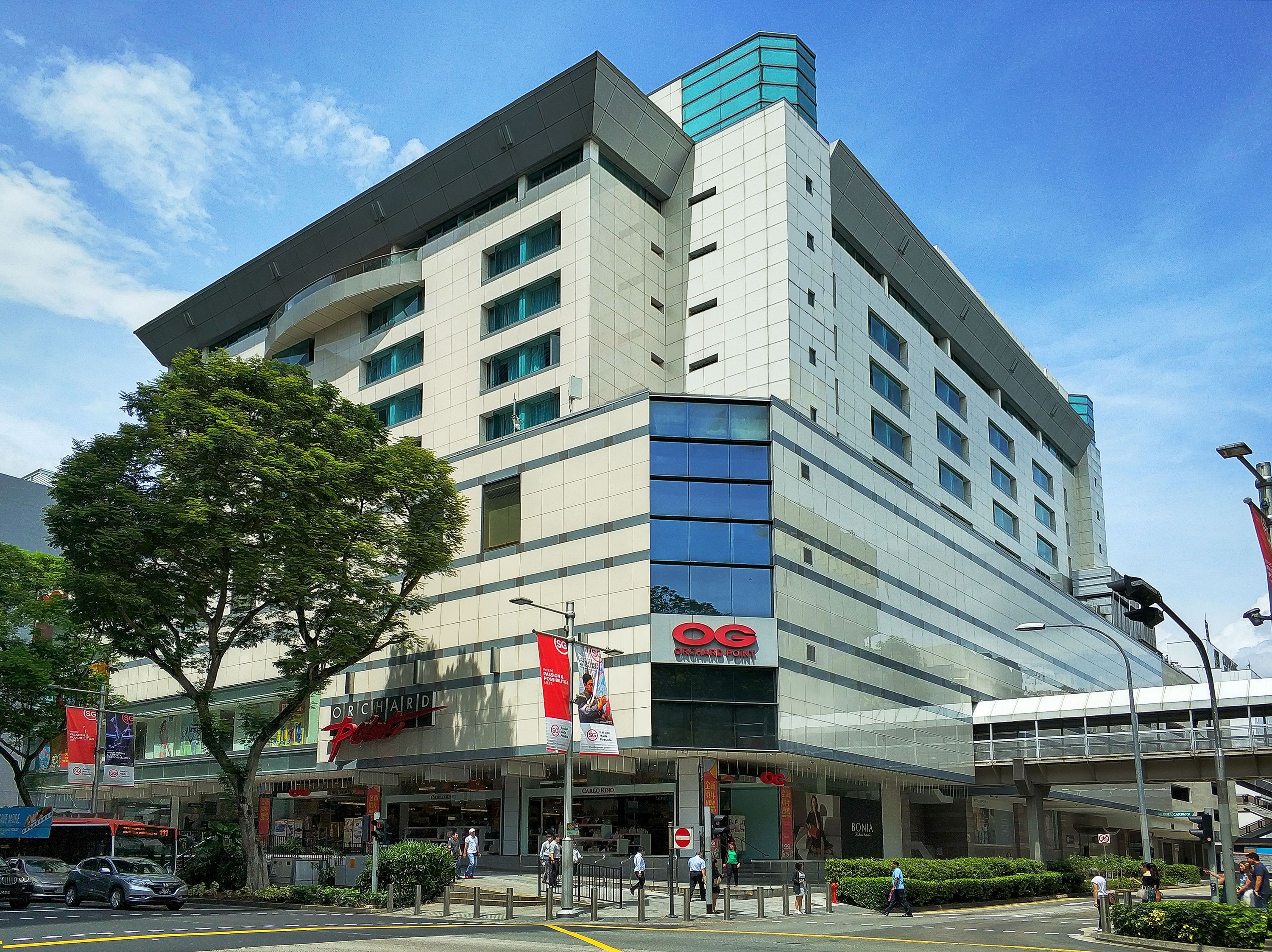 Orchard Point Serviced Apartments in Singapore, modern high-rise exterior with street-level entrance