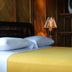 Wipeout Cabaña Restaurant in Las Tunas, guest room with bed, white pillows and yellow bedspread