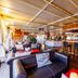 Botel Marina in Rijeka lounge with leather seating and a wood-paneled bar with stools