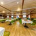Botel Marina in Rijeka dining room with tables, green chairs, and wood flooring
