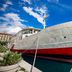 Botel Marina in Rijeka docked on the water, showing a white ship hull with red lower section.